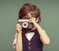 Boy holding camera