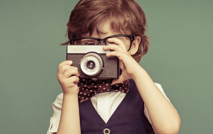 Boy holding camera